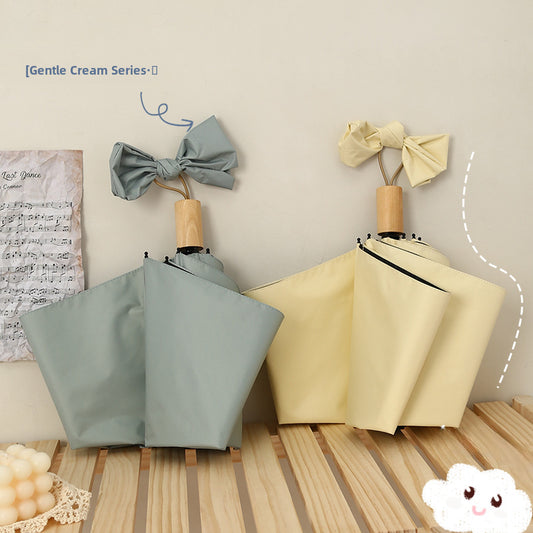 Tri-fold hand handle umbrella wholesale solid color vinyl sunscreen UV protection sunny and rainy sun umbrella folding umbrella